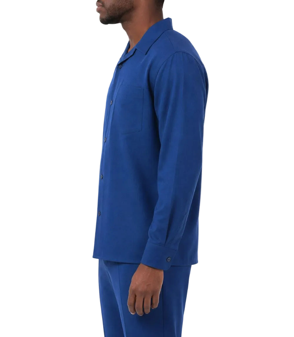 Man wearing a blue shirt and pants on a white background