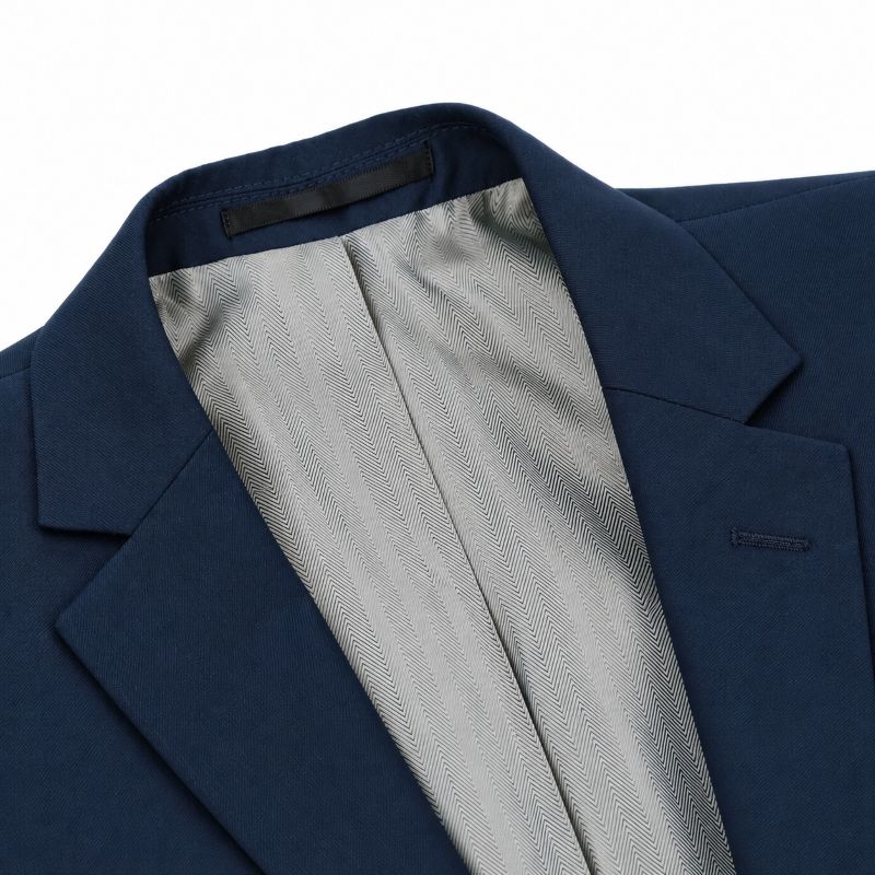 Close-up of a navy blue blazer showing the collar, lapel, and a light gray textured inner lining.