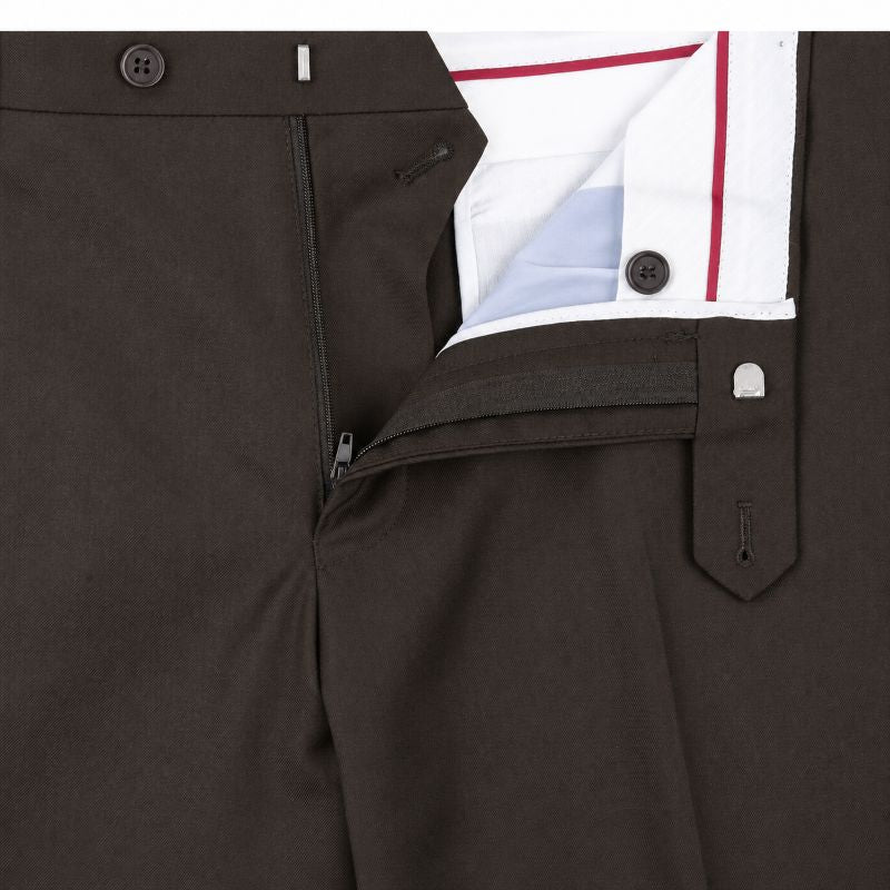 Close-up of dark brown tailored trousers showing the front waistband, button closure, zippered side pocket, and a white dress shirt with red and light blue pinstripes tucked into the waistband.