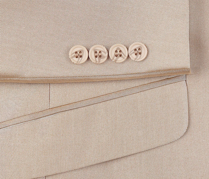 Close-up of the premium sharkskin fabric and elegant lapel on a Renoir beige Italian-styled 2-piece suit.