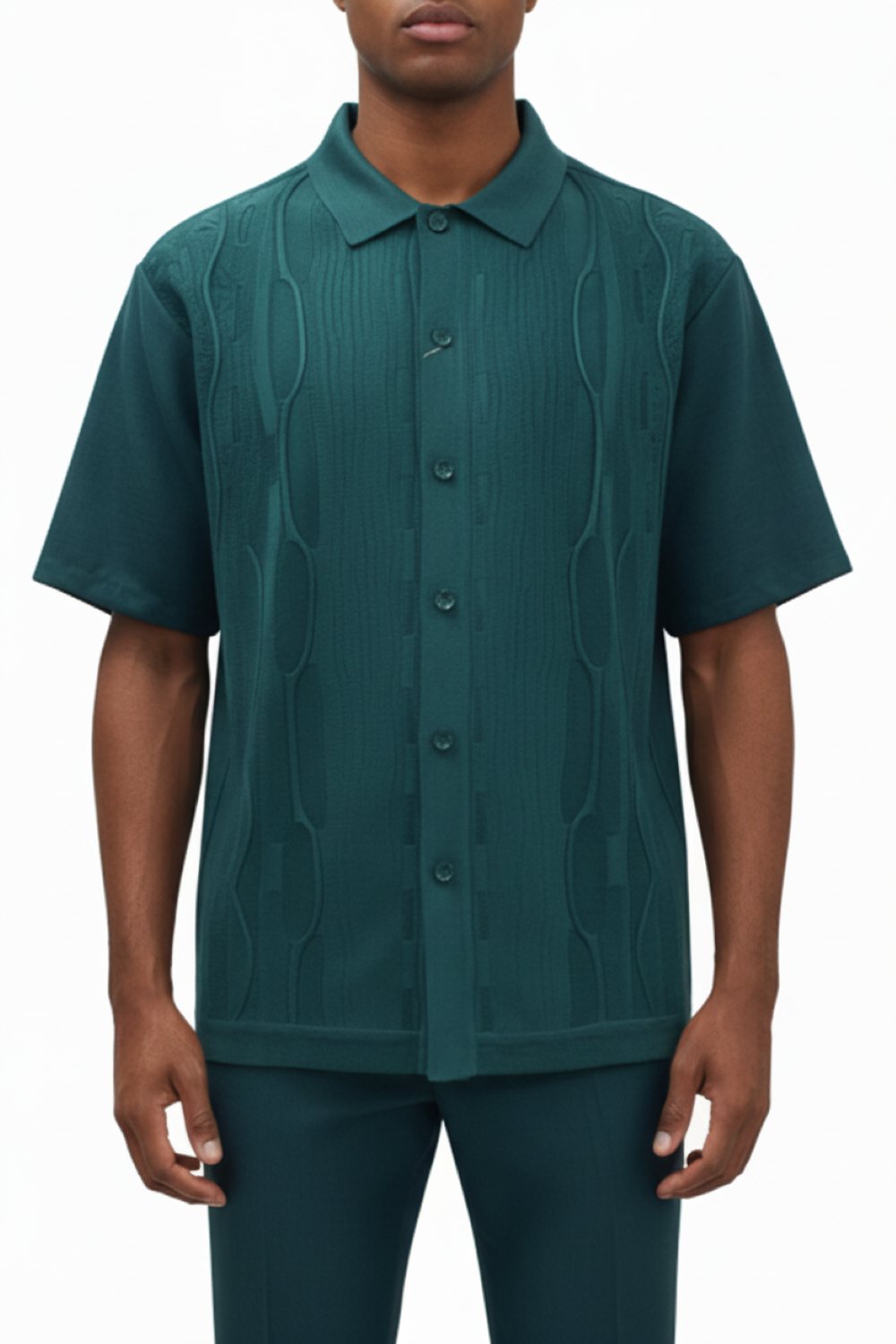 Man wearing a green patterned shirt on a white background