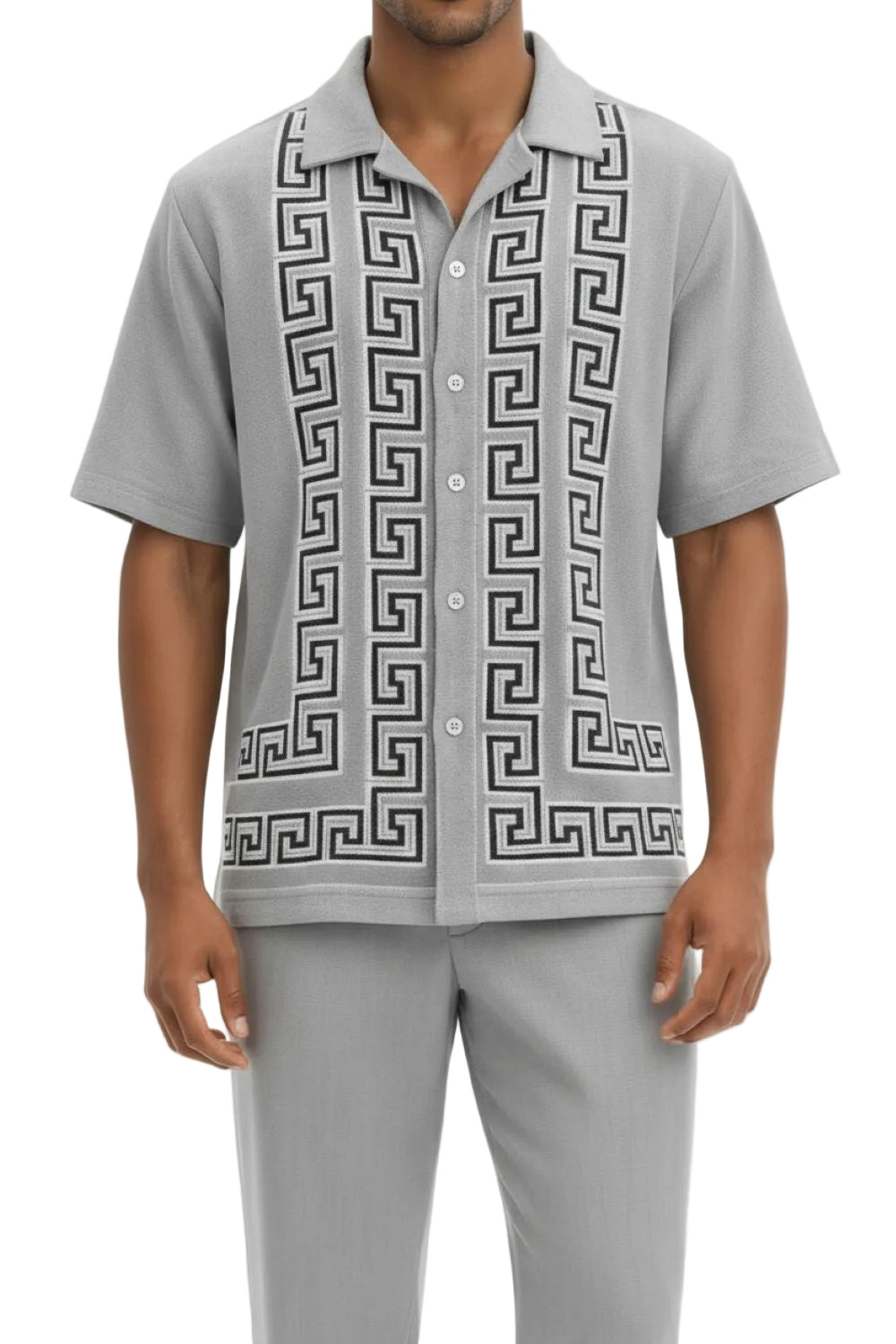 Man wearing a gray shirt with a geometric pattern on a white background