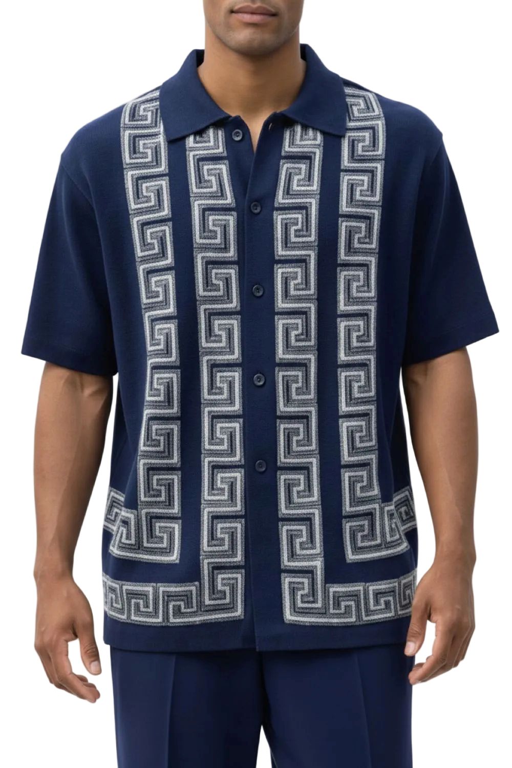 Man wearing a navy blue shirt with white geometric pattern on a white background