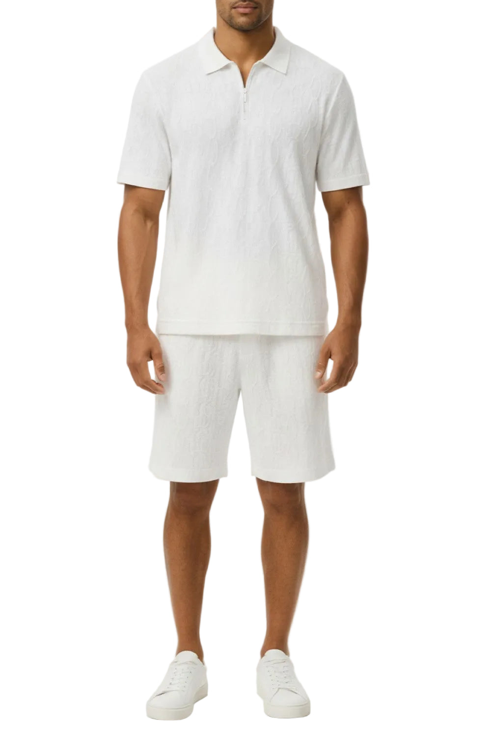 Man wearing a white polo shirt and shorts on a white background