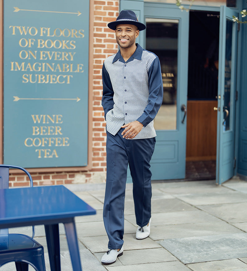 Detail shot: Man in a luxurious Montique navy mini-checkered long-sleeve walking suit set with tailored pants.