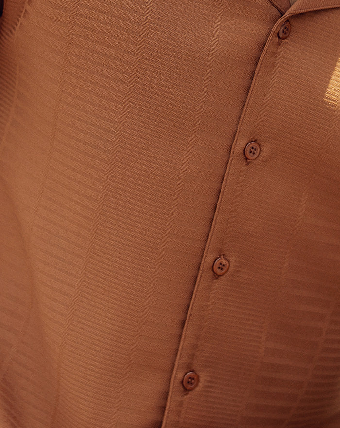 Close-up of solid Cognac 2 Piece Long Sleeve Walking Suit Set sleeve, showing cuff buttons.