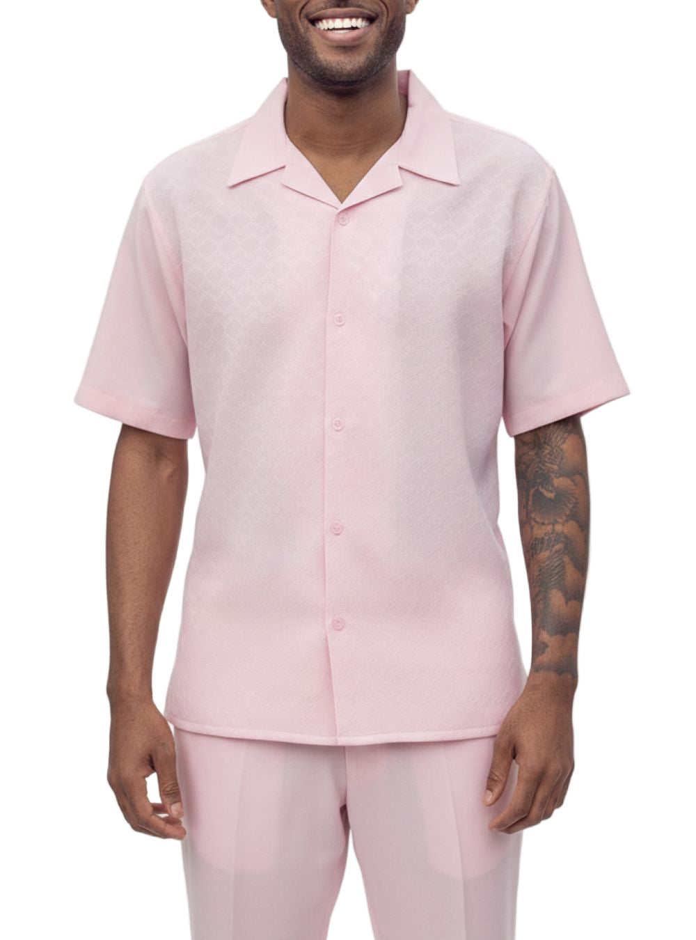 Man wearing a pink shirt and pants on a white background