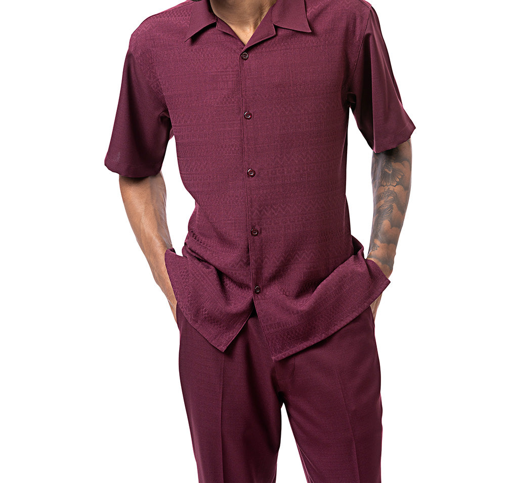 Person wearing a maroon shirt and pants on a white background