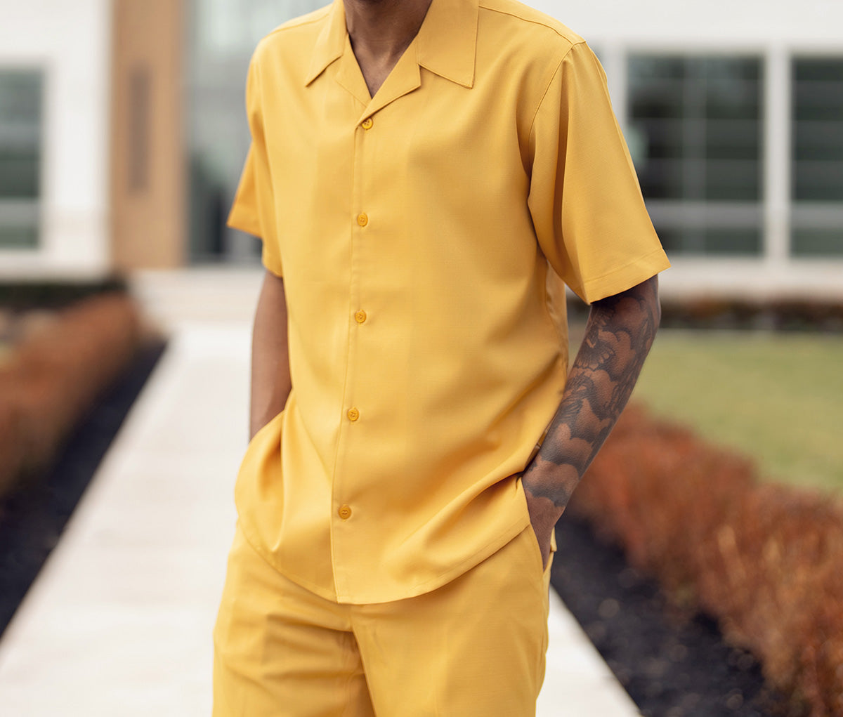 Close-up of the solid gold short sleeve on the Montique Solid Gold Walking Suit 2 Piece Short Sleeve Set, showing buttons.
