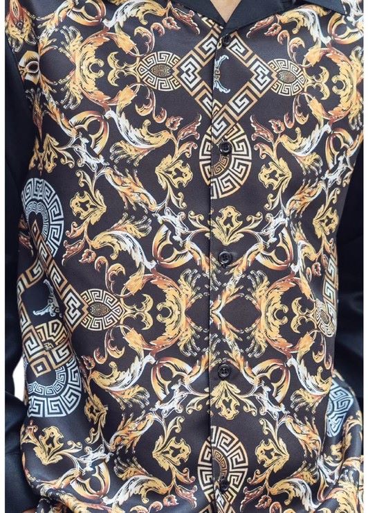 Montique Black and gold paisley patterned walking suit shirt with long sleeves, showing the collar and sleeve.