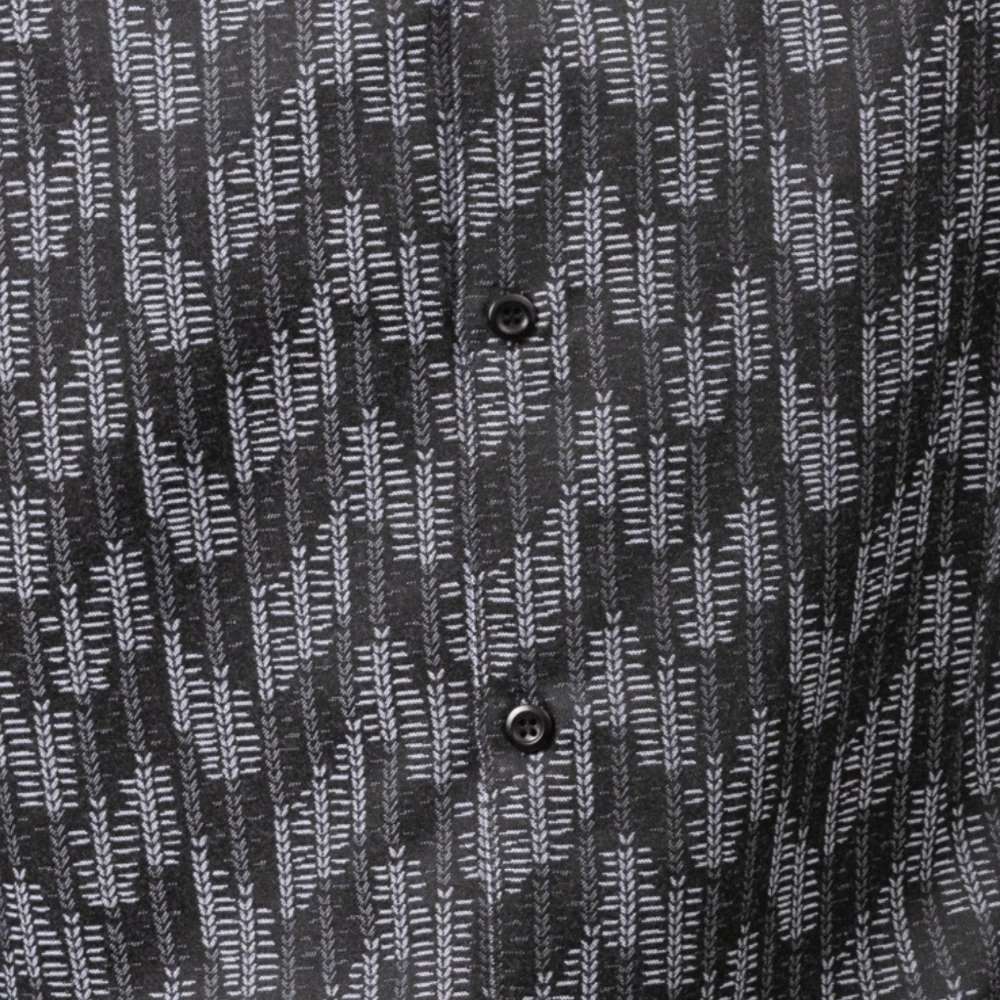 Close-up of luxurious Montique black and white fabric for a men's walking suit, showcasing premium texture.