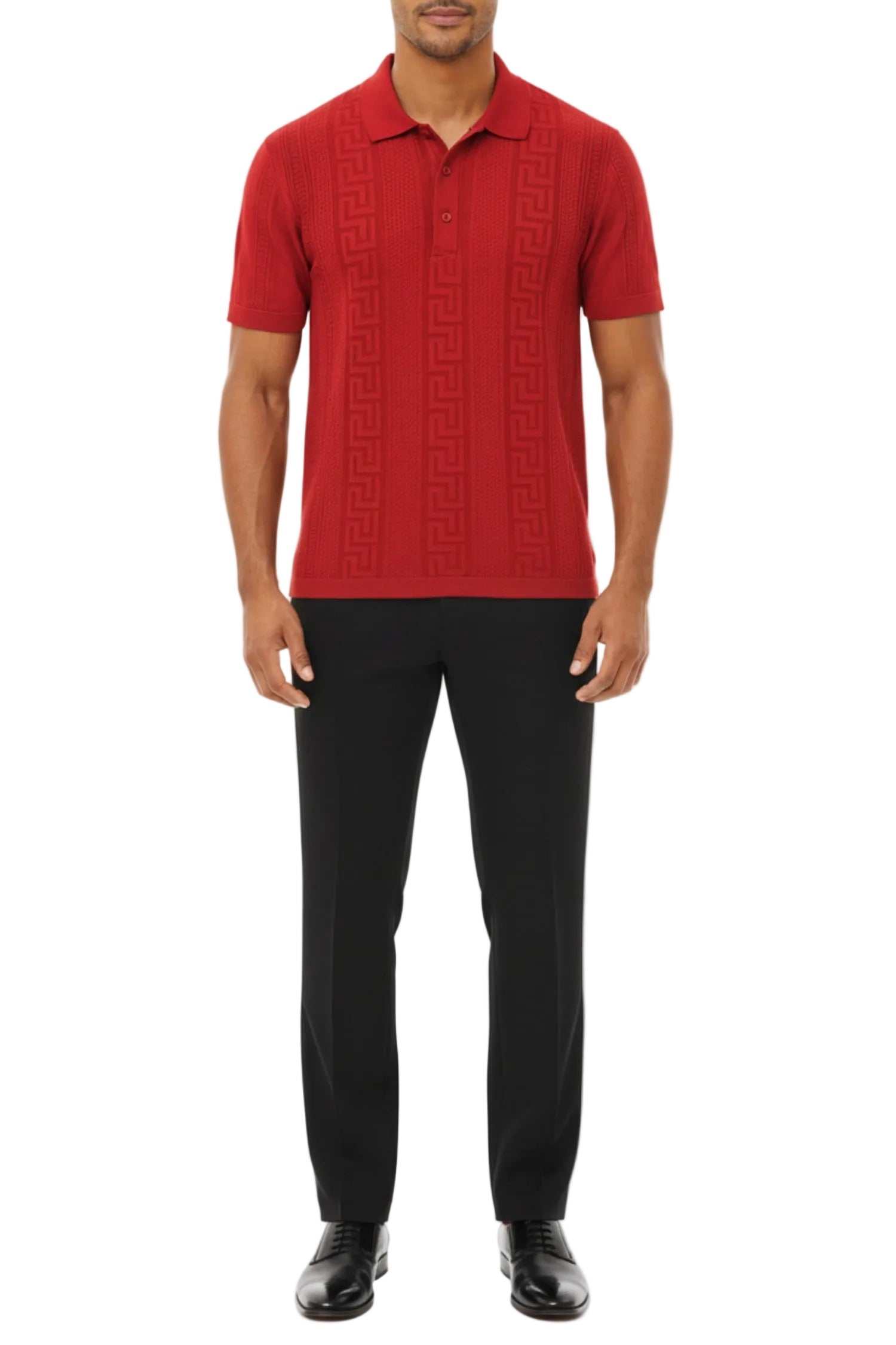 Man wearing a red patterned polo shirt and black pants on a white background
