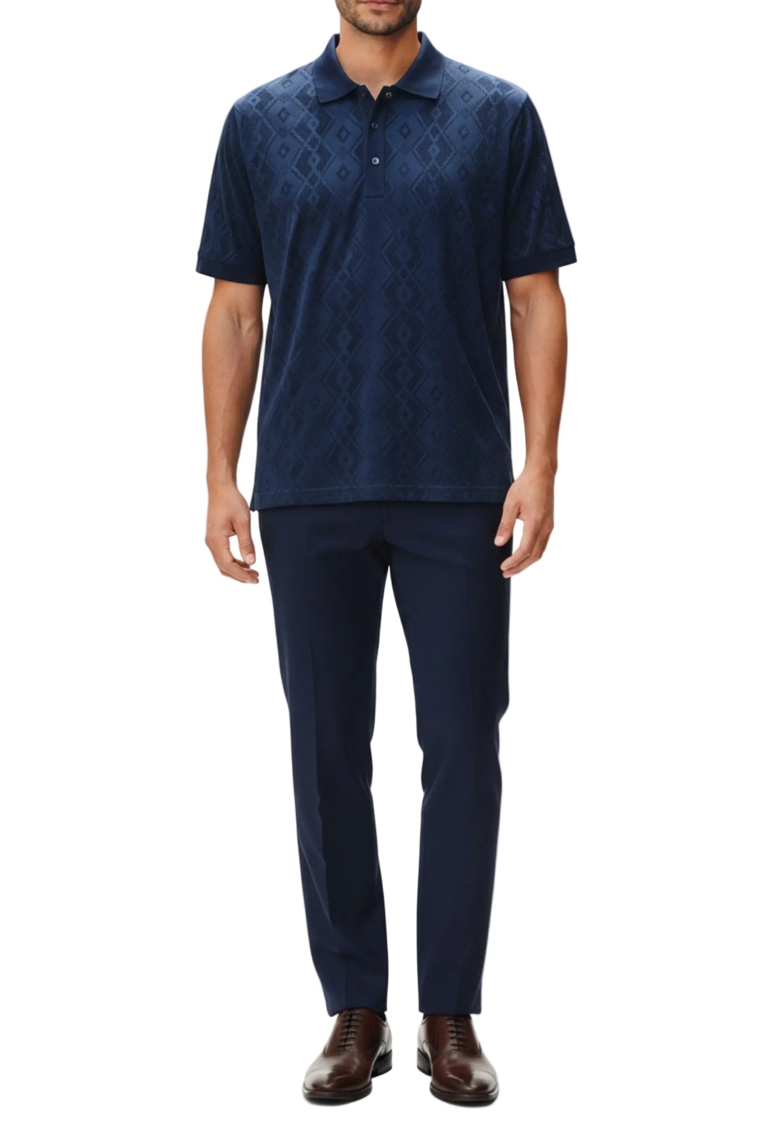 Man wearing a navy patterned polo shirt and pants on a white background