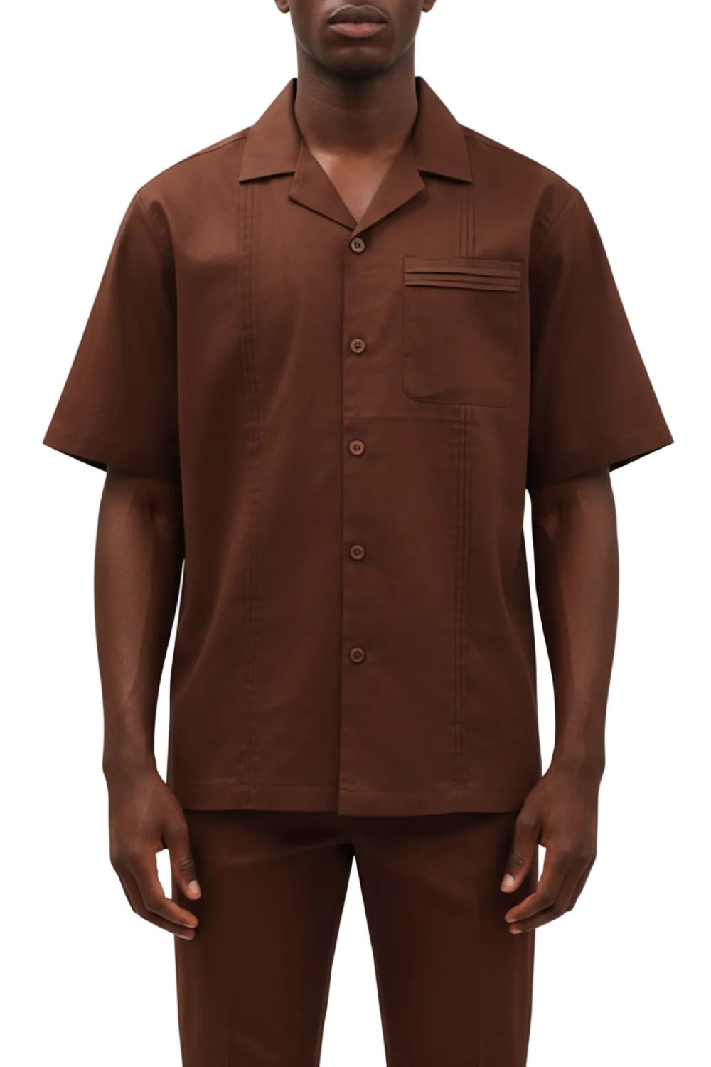 Man wearing a brown short-sleeve shirt with open collar on a white background