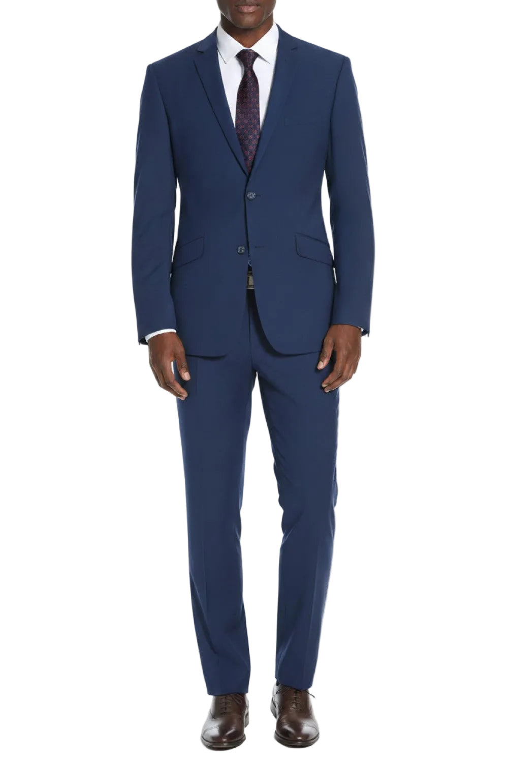 Man wearing a blue suit with a white shirt and brown shoes on a white background