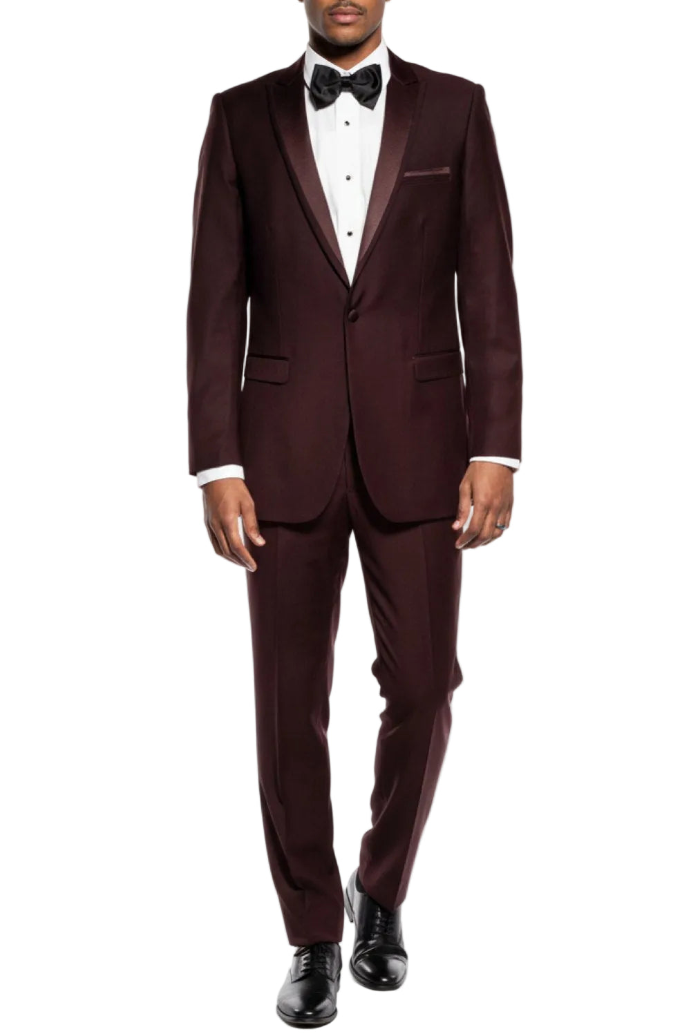 Man wearing a Brown tuxedo with a bow tie on a white background