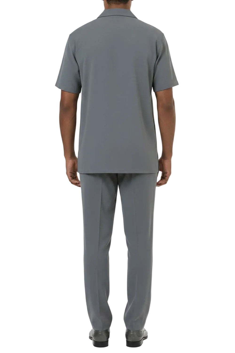 Person wearing a gray polo shirt and pants on a white background
