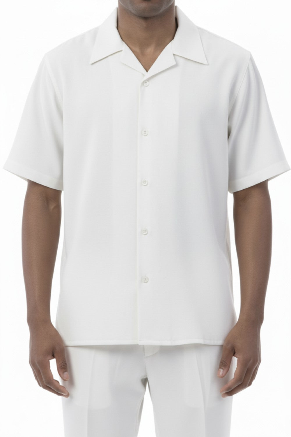 Man wearing a white short-sleeve button-up shirt and pants on a white background