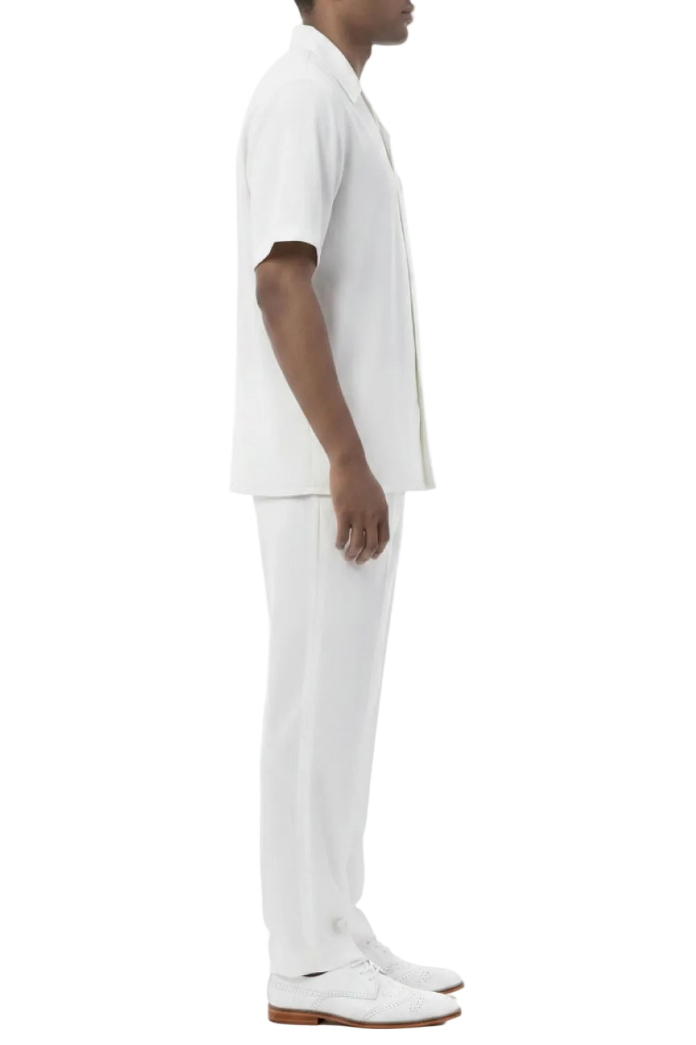 Person wearing a white outfit on a white background