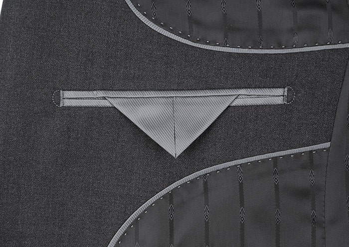 Close-up of solid Charcoal Gray Vanderbilt Collection 2-button regular fit suit pocket, collar.