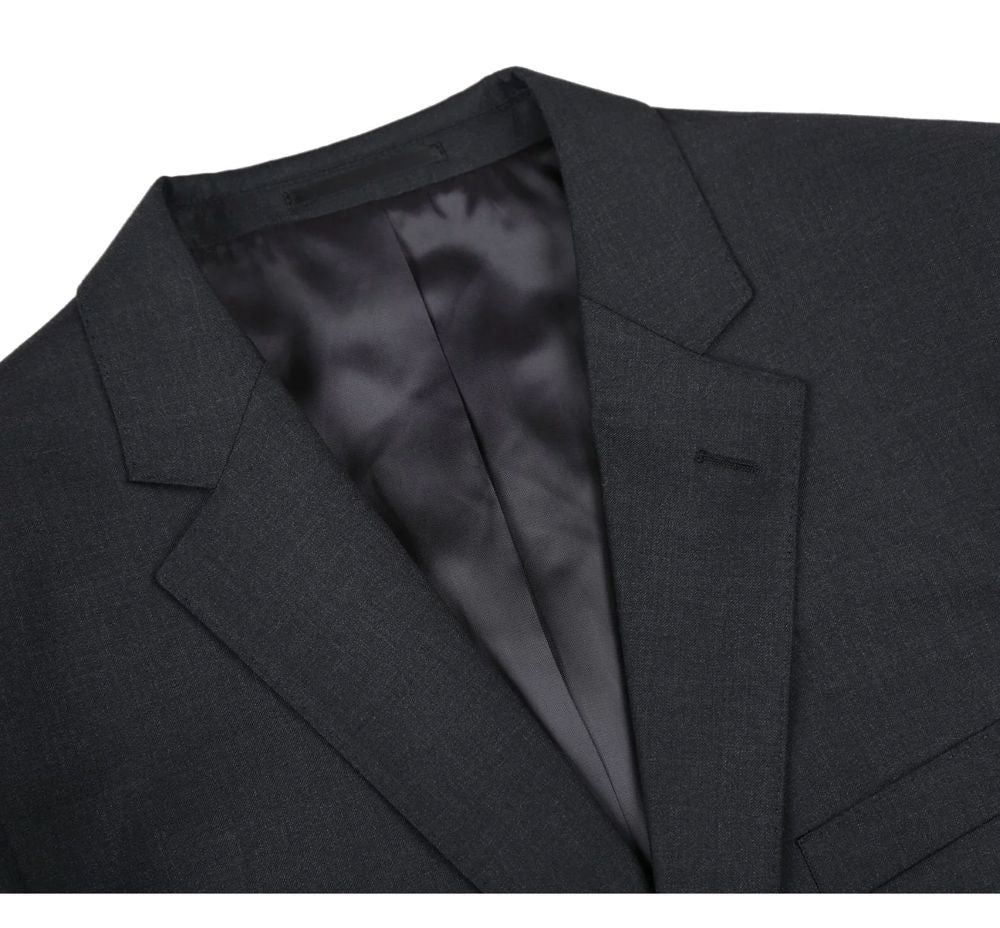 Close-up of a dark gray suit jacket with a white background