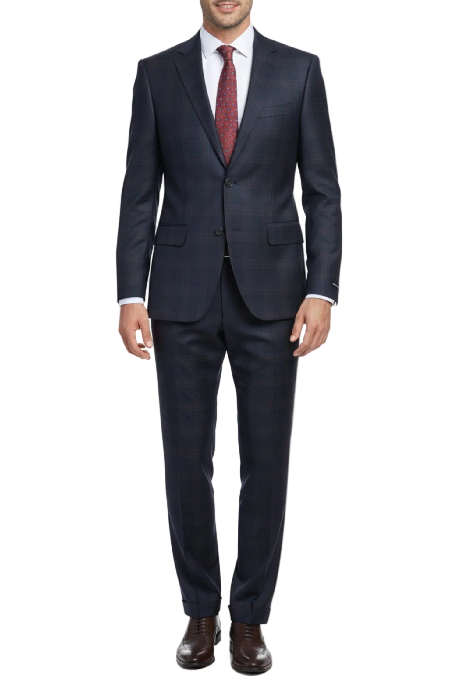 Man wearing a dark blue suit with a red tie on a white background