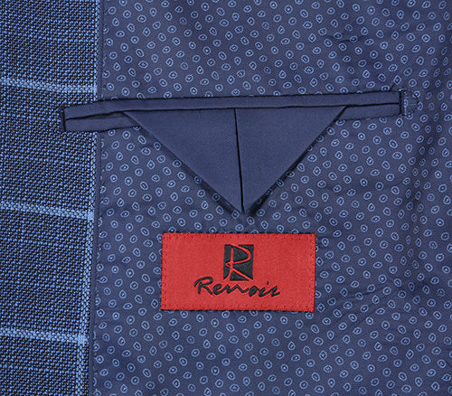 Detail of Renoir's classic blue windowpane blazer, showcasing premium fabric texture and a rich maroon lining.
