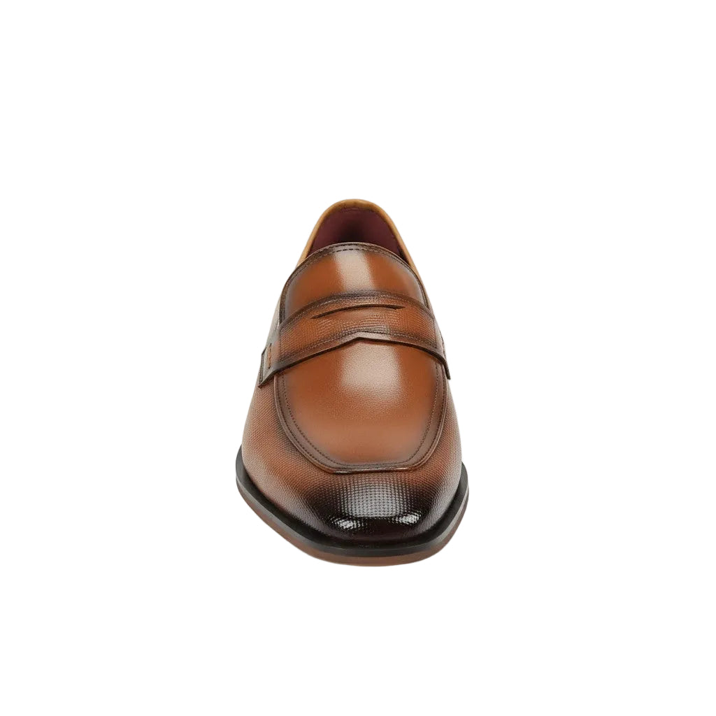 Tan leather loafer shoe on a white background
