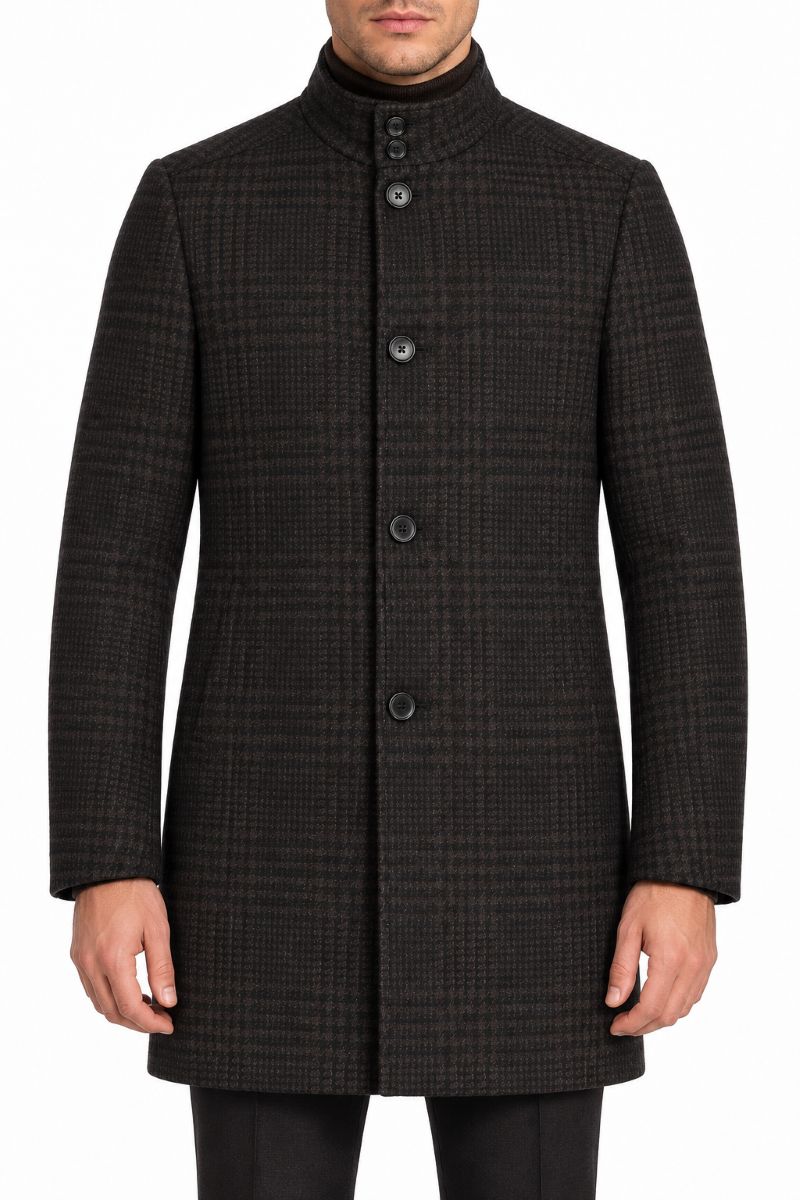 A man wearing a dark charcoal gray and black checkered coat with a high stand collar and front buttons, shown from the chin down against a plain white background.