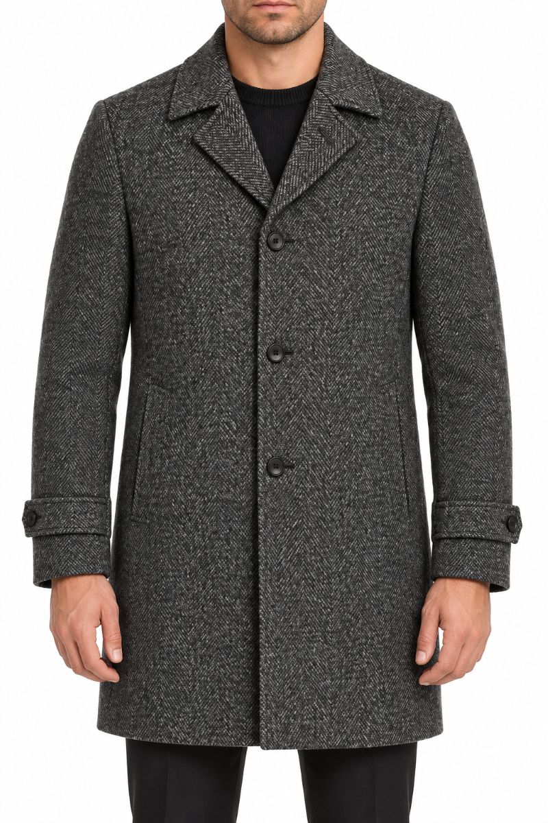 A man wearing a dark gray and black textured wool-blend overcoat with a notched lapel and three front buttons, shown from the chin down on a plain white background.