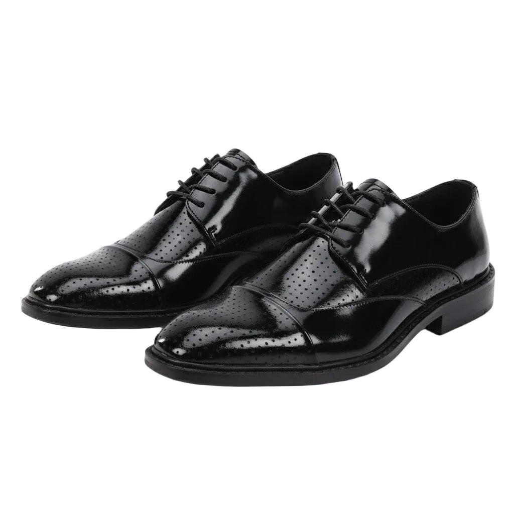 Pair of black dress shoes on a white background