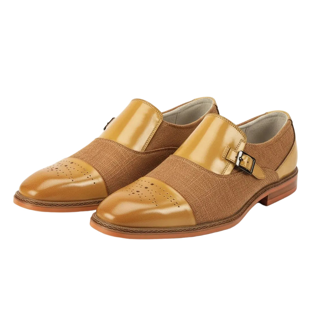 Pair of scotch tan shoes with a buckle on a white background
