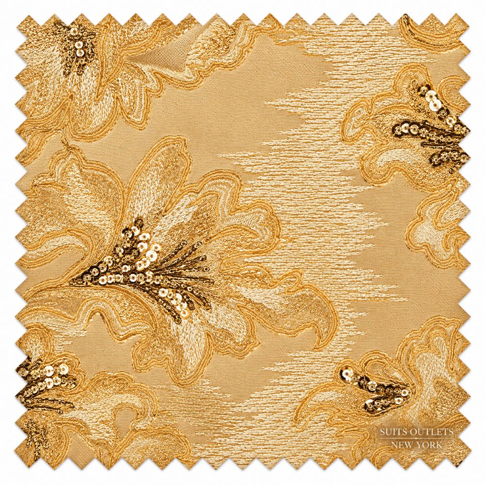A square fabric swatch with scalloped edges, featuring a gold and beige floral pattern with sequined details. The brand name 'Suits Outlets New York' is printed in the bottom right corner.