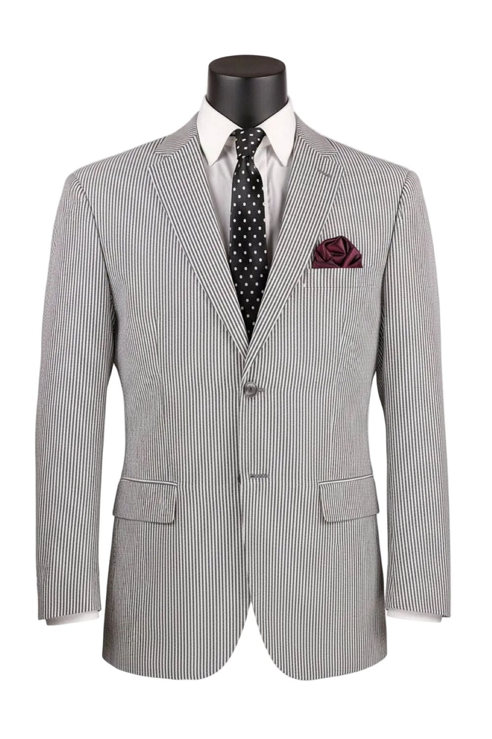 Gray pinstripe suit on a mannequin with a white shirt, polka dot tie, and pocket square.