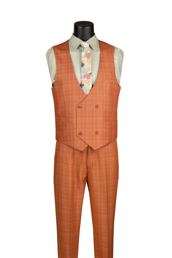 A men's three-piece suit displayed on a black mannequin torso, featuring a double-breasted orange-brown plaid vest, matching trousers, and a light green dress shirt with a multicolor patterned tie.