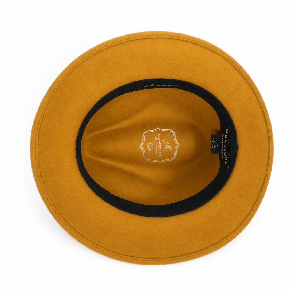 Interior view of gold wool felt wide-brim fedora with black sweatband and gold logo