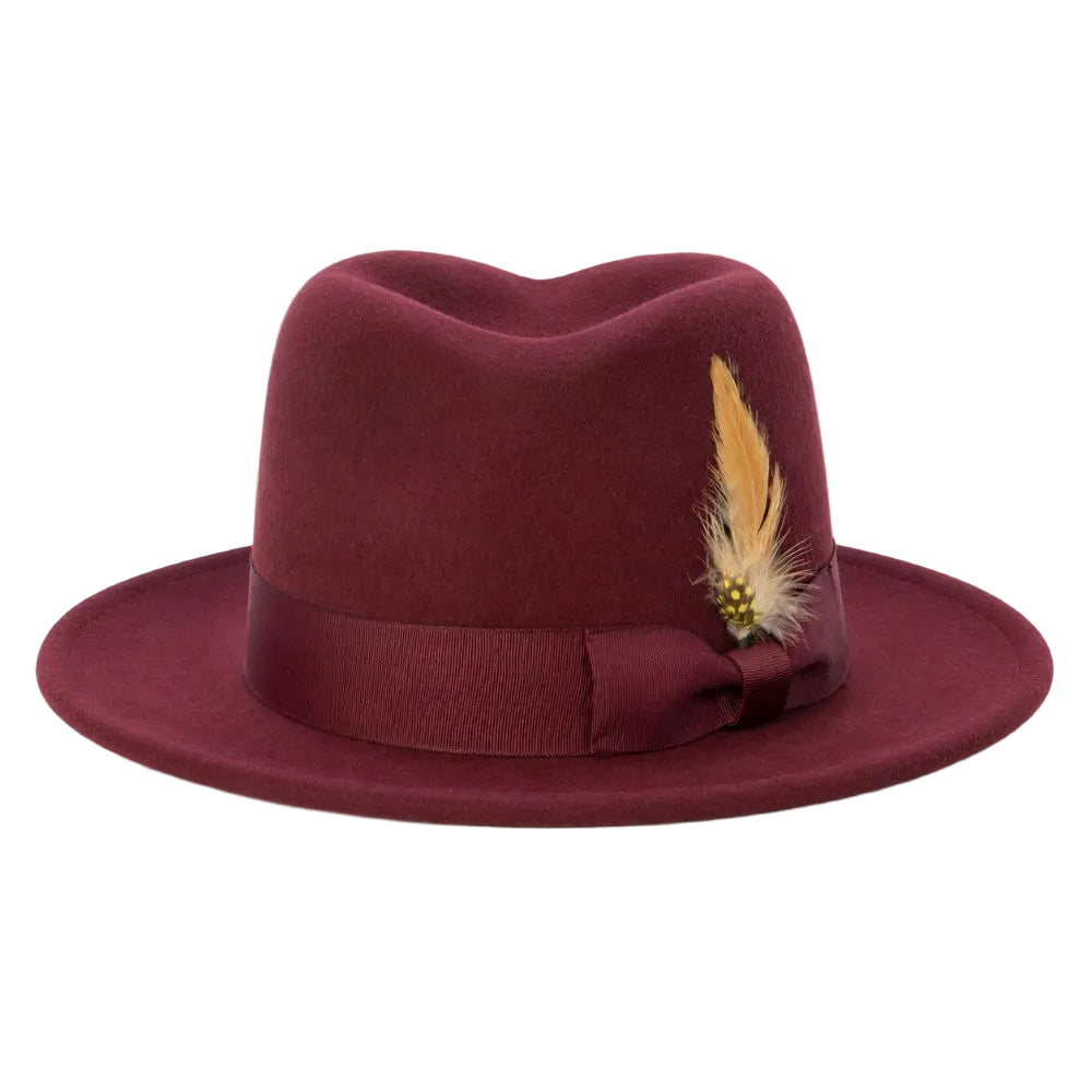 A burgundy felt fedora hat with a matching ribbon band and bow, decorated with a tan feather and small gold bead accent, shown on a plain white background.