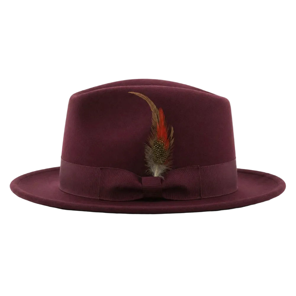 A structured fedora hat in deep burgundy wool, featuring a matching grosgrain ribbon band and bow, adorned with a decorative feather accent, set against a plain white background.