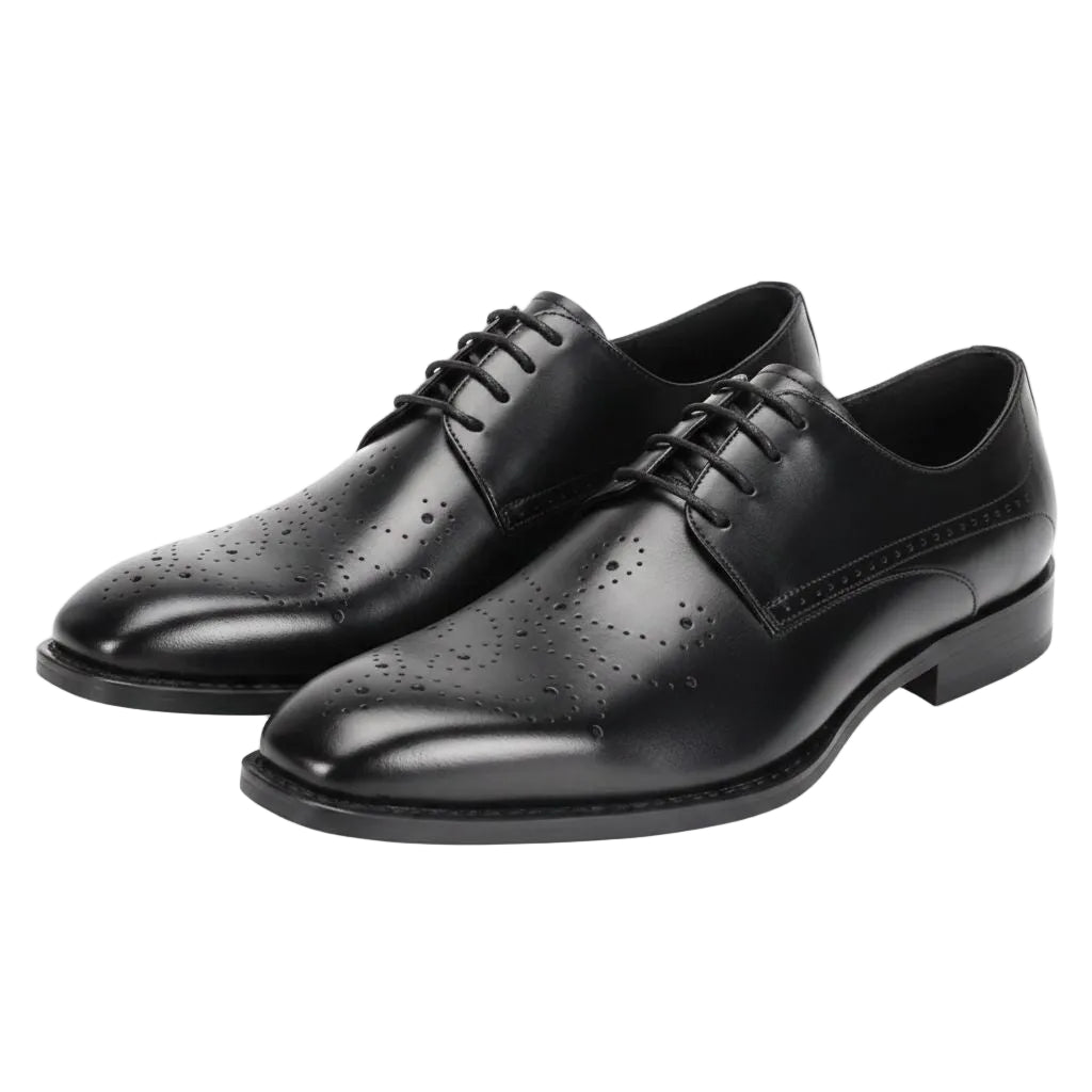Pair of black leather dress shoes on a white background