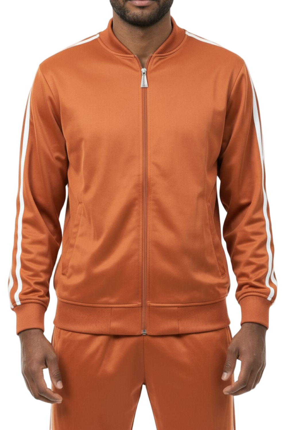 Man wearing an orange tracksuit with white stripes on a white background