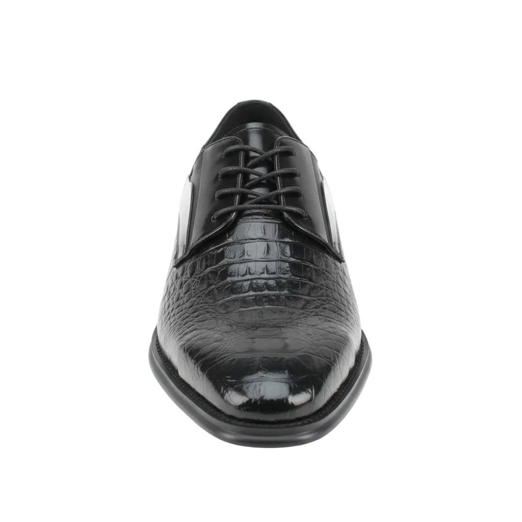Black dress shoe with crocodile texture on a white background
