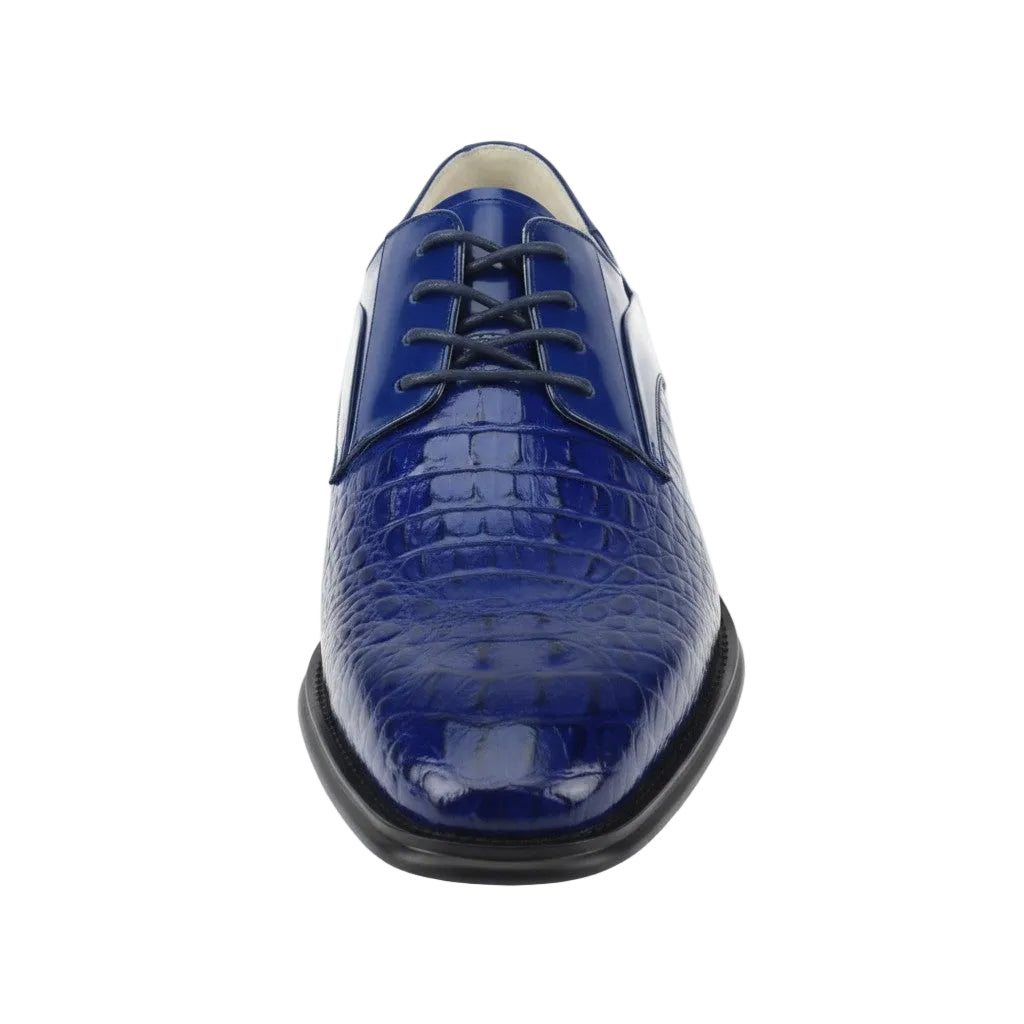Blue crocodile-patterned dress shoe on a white background