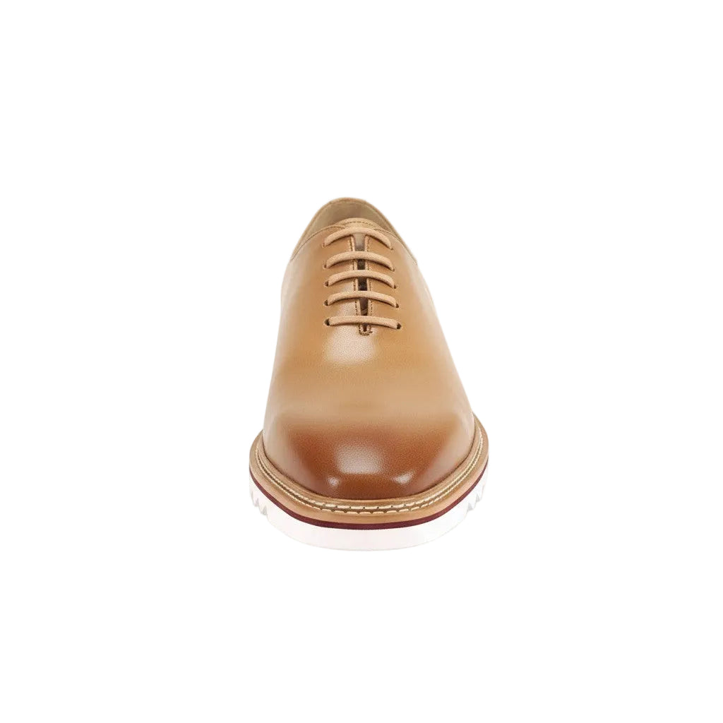 Latte leather dress shoe on a white background