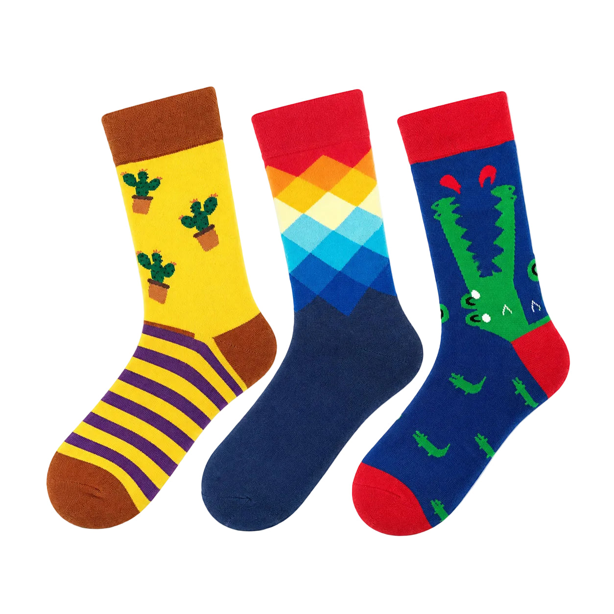 Three colorful crew socks displayed side by side on a plain white background. The left sock is yellow with brown cuffs and toes, featuring green cactus illustrations and purple horizontal stripes near the foot.