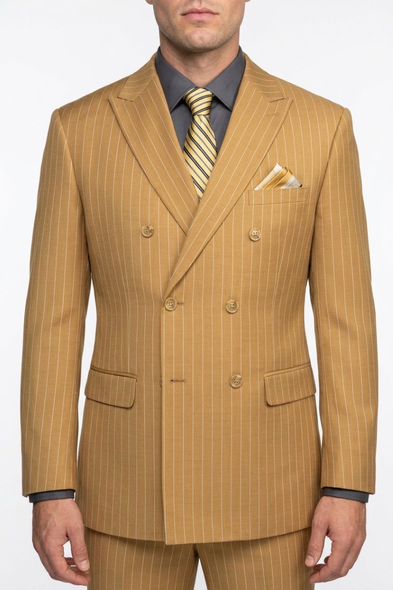 A man wearing a tan double-breasted pinstripe suit with a gray shirt and a yellow striped tie, shown from the waist up against a white background.