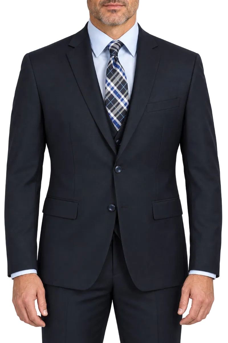 A man wearing a dark navy blue suit jacket with a light blue dress shirt and a blue, gray, and white plaid tie, shown from the waist up against a plain white background.