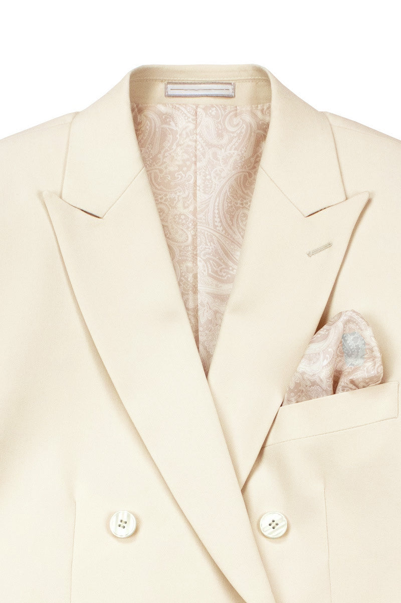 Detail of Vinci's luxurious bone white slim fit double-breasted suit, showcasing fabric texture and elastic waistband.