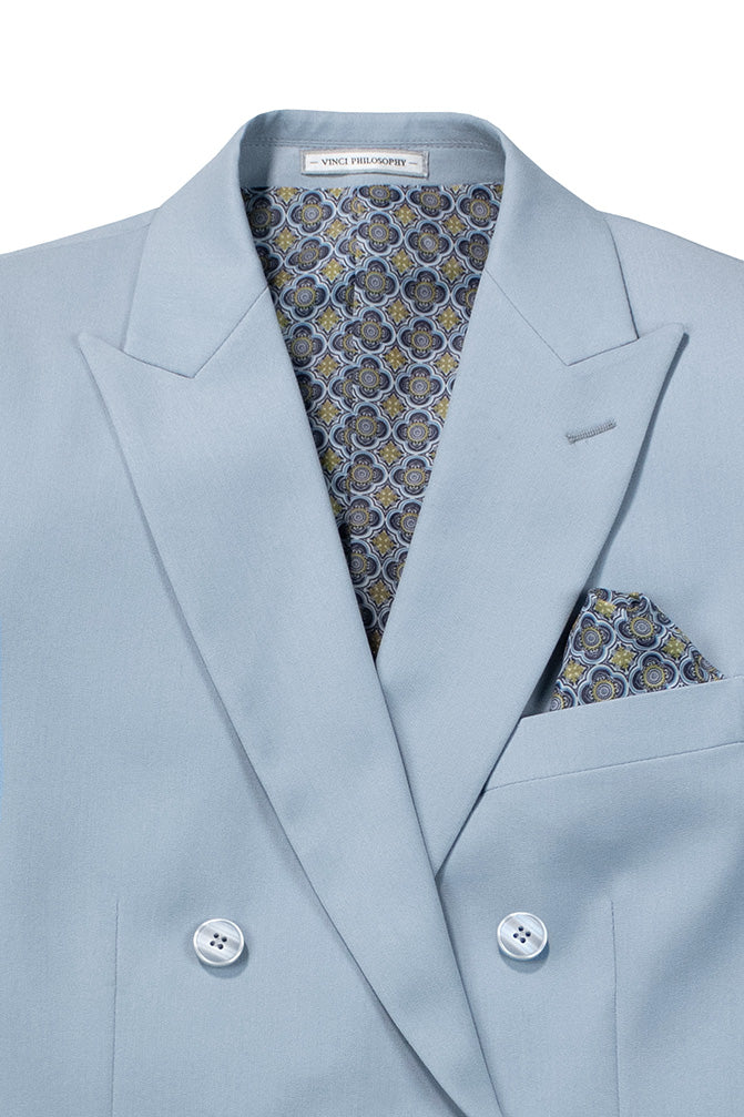 Close-up of luxurious Vinci ice blue double-breasted suit fabric, showing fine texture and tie detail.