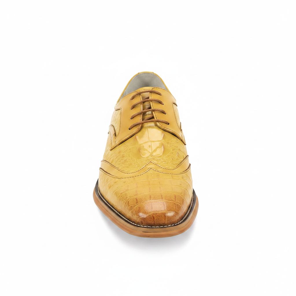 Yellow leather dress shoe on a white background