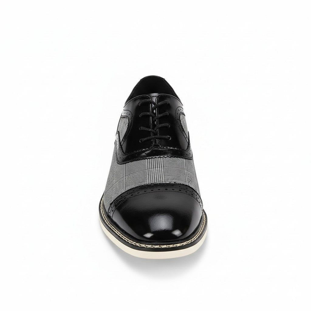 Black and white dress shoe on a white background